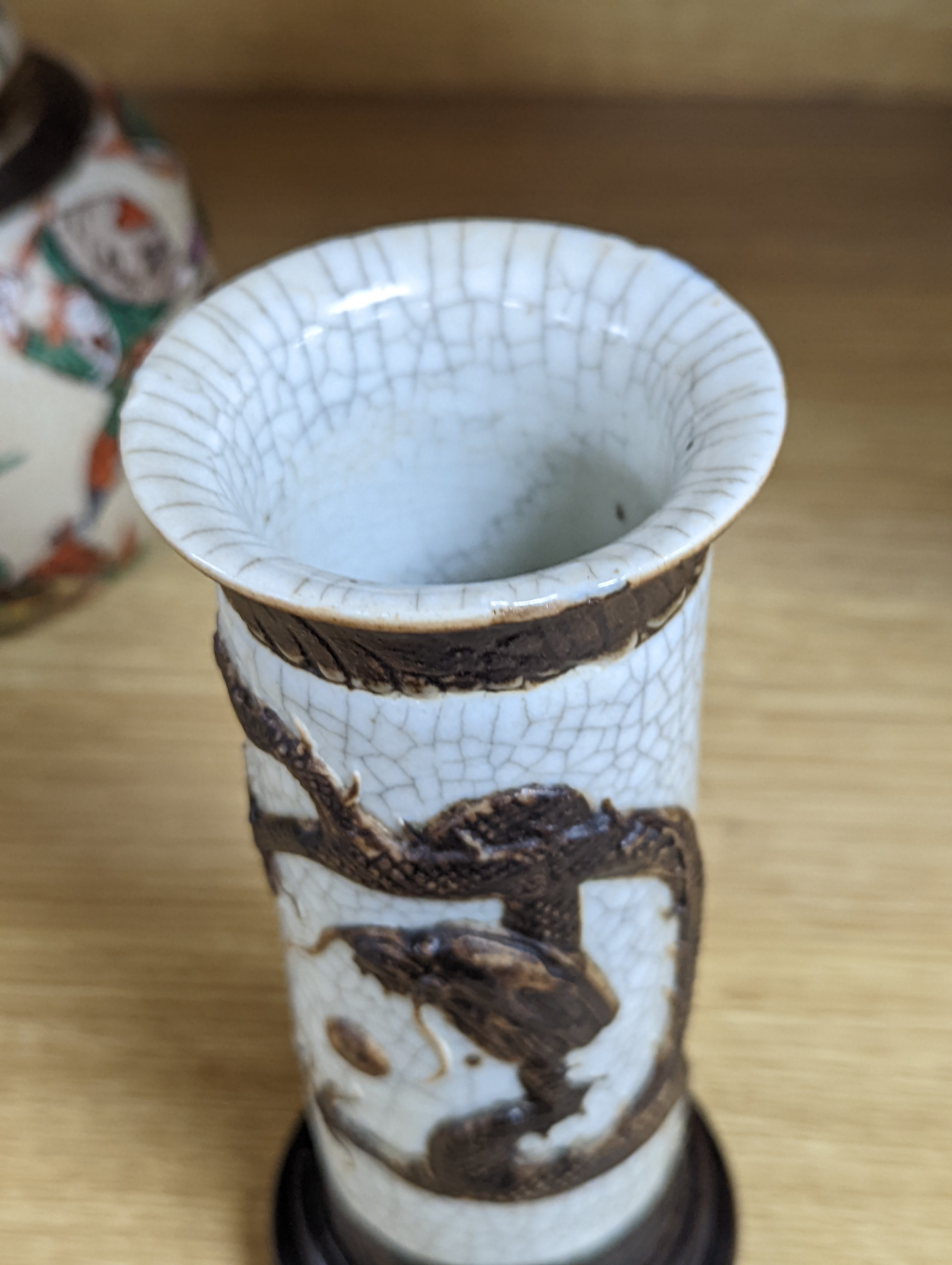 A Chinese famille verte crackle glaze jar and cover, 14.5cm, two famille rose dishes and a crackle glaze ‘dragon’ vase, all late 19th/early 20th century
